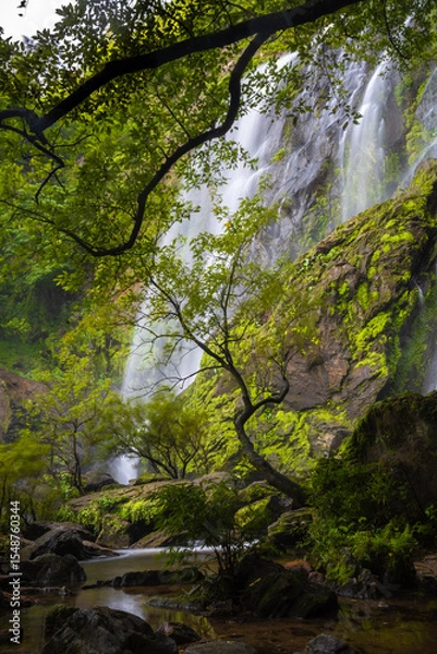 Fototapeta 
Khlong Lan Waterfall is one of the most beautiful and grand waterfalls in Thailand. Below it is a large pool where you can swim. It is located in Khlong Lan National Park, Kamphaeng Phet
