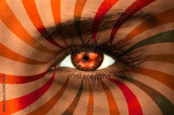 Obraz Orange eye on patterned face