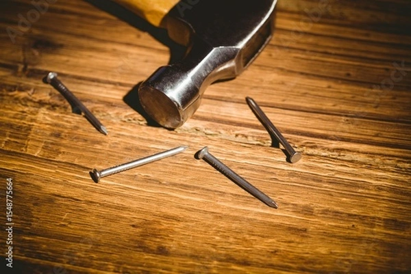 Obraz Hammer head with handle is being shown in flat design workshop scene, highlighting steel nails