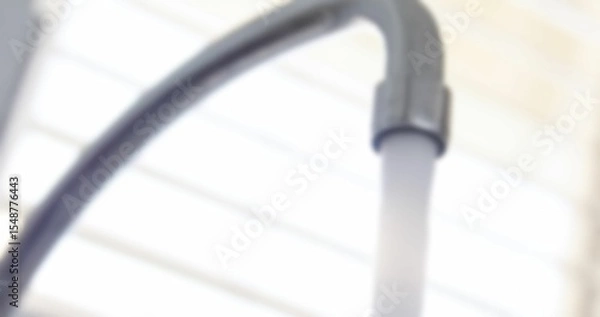 Fototapeta Water running from faucet