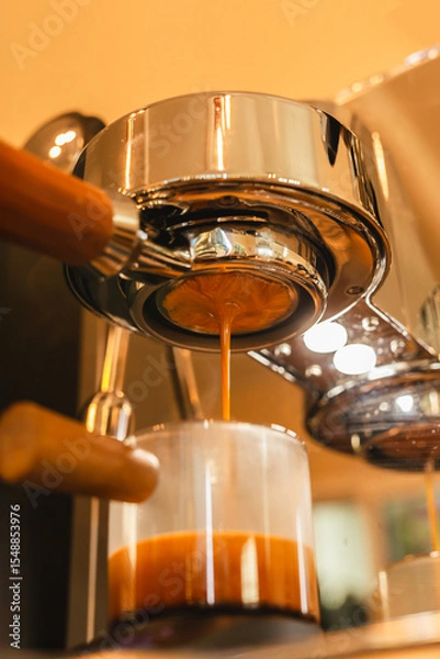 Fototapeta Close up of Espresso machine making an fresh espresso with a portafilter.