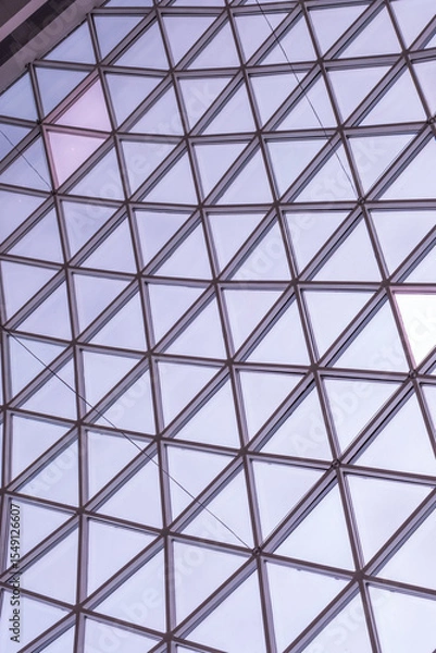 Obraz Architectural glass structure with a geometric triangular pattern, Steel glass roof wall construction transparent window with support system