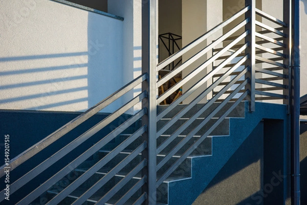 Fototapeta Modern metal railings and handrails in industrial style. The metal is treated with a primer and anti-corrosion paint.
