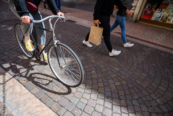 Obraz A cyclist on the street in an Italian city.