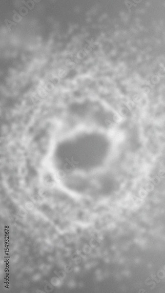 Obraz Blurred gray crater like depression surrounded by textured gray ground