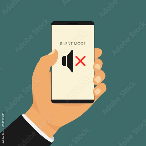 Obraz Smartphone in silent mode held by man. Hand holds a smartphone displaying a muted speaker icon with the words Silent Mode