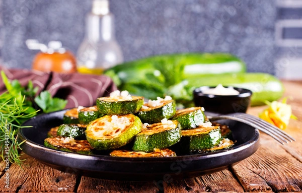 Obraz Tasty fried zucchini slices on a plate