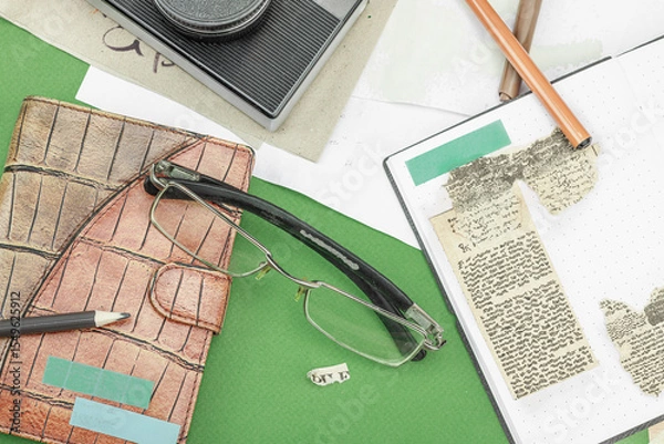 Obraz Flat lay with vintage camera, cassette, notebook, key and research tools on green background