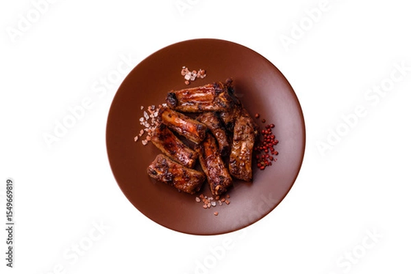 Obraz Meat, beef ribs in a marinade grilled with salt and spices. Grilled ribs