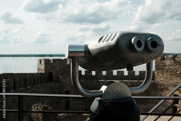 Obraz Coin-operated binocular viewer set up on a tower of Ram Fortress, facing the Danube River. A popular tourist destination in Serbia country