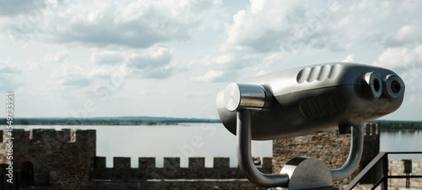Obraz Coin-operated binocular viewer set up on a tower of Ram Fortress, facing the Danube River. A popular tourist destination in Serbia country