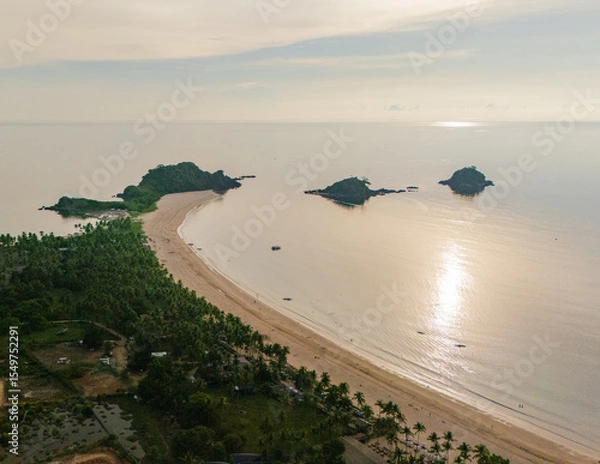 Obraz Stunning aerial view of Nacpan Beach’s winding shore, vibrant tropical greenery, and sparkling clear sea in El Nido, Palawan, Philippines