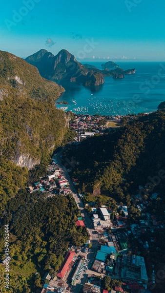 Obraz Aerial shot of El Nido town with islands in a Tranquil Sunset Over Corong Corong Beach, El Nido, Palawan,  Philippines.