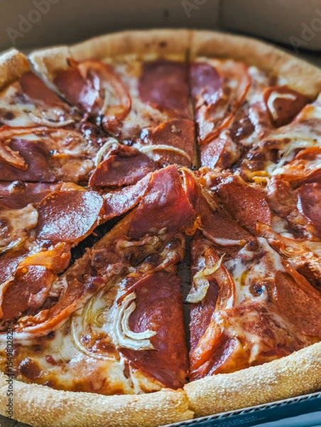 Fototapeta Pepperoni pizza slices arranged in circular pattern, cheese melting, crust visible