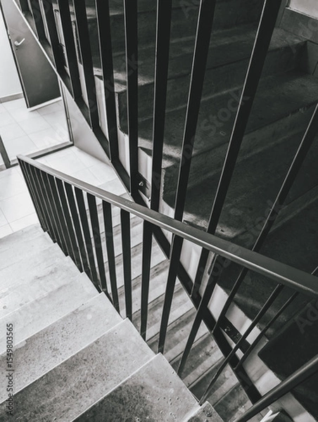 Fototapeta Staircase with black railings, concrete steps, modern architecture, monochrome scheme