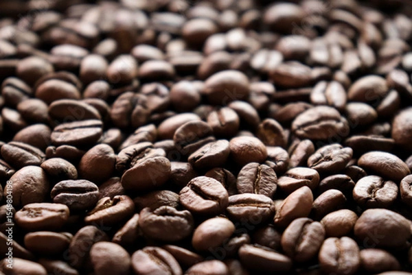 Fototapeta Roasted coffee beans close-up macro shot.Rough textured background pattern.