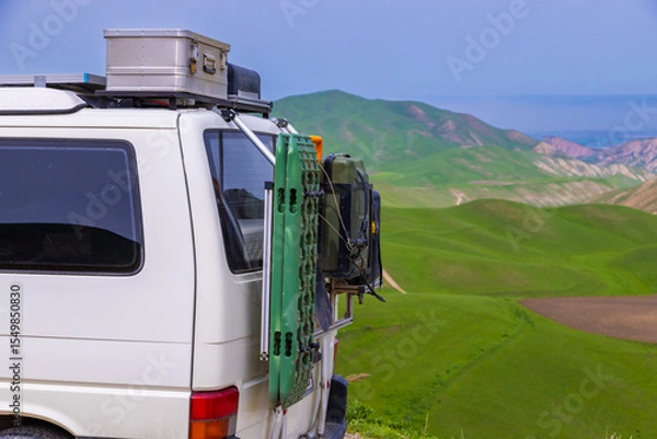 Obraz Van parked with luggage carrier in serene mountainous landscape