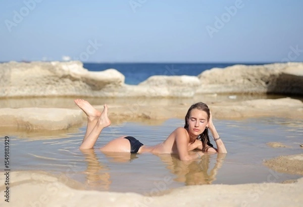 Obraz beautiful woman in a natural pool