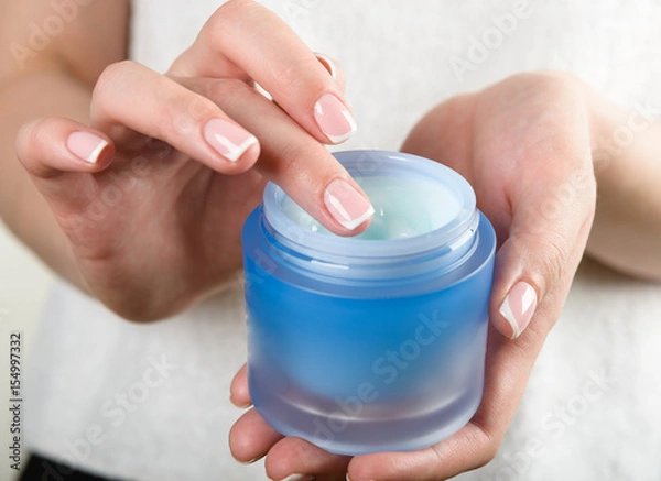 Fototapeta beautiful woman hands with cream
