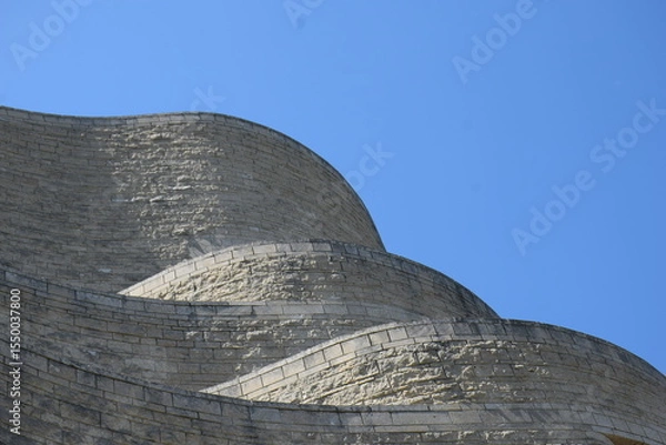 Obraz Section of curvy stone building  