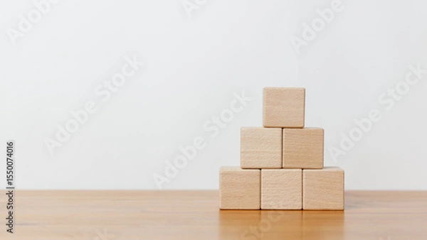 Obraz Empty wooden blocks and stack up in white background. Arranging of cube shape toy blocks in business concept on building, progress or development.