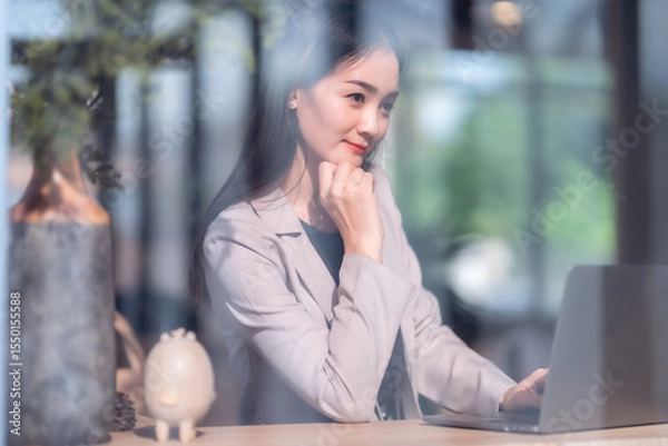 Obraz Asian freelance people business female talking making using casual working with laptop computer and coffee at home in the living room indoors artificial rose bouquet of red and pink roses rose vase