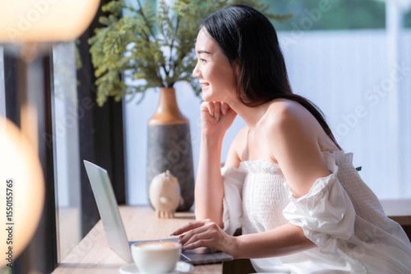 Obraz Asian freelance people business female talking making using casual working with laptop computer and coffee at home in the living room indoors artificial rose bouquet of red and pink roses rose vase