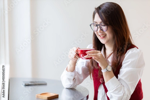 Obraz Close-up beautiful happy Smiling of hands Holding cup mug of Hot coffee latte wits business female in coffee shop like the background, communication concept