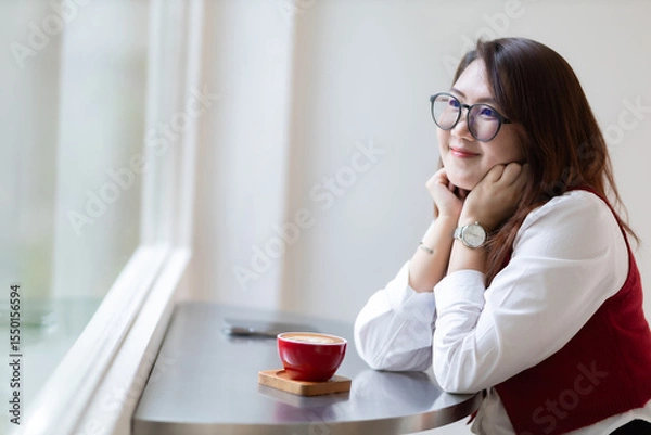 Obraz Close-up beautiful happy Smiling of hands Holding cup mug of Hot coffee latte wits business female in coffee shop like the background, communication concept