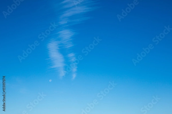 Obraz Lined cloud formation with moon