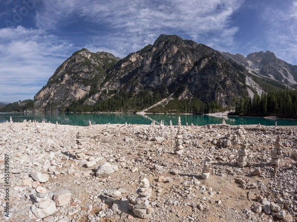 Obraz Balanced stack of zen stones with mountains and lake in the background. Meditation relaxation concept.