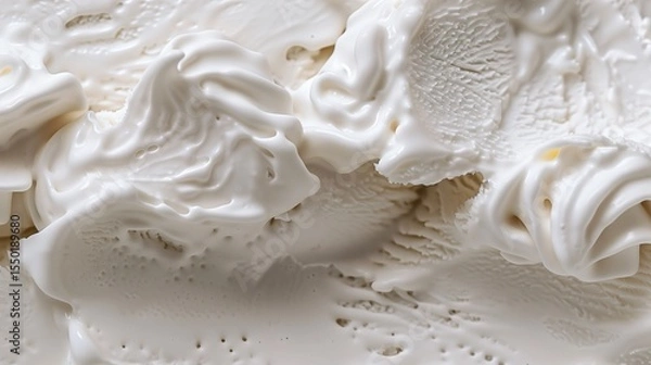 Fototapeta Detailed macro shot of smooth vanilla ice cream with swirled creamy texture, highlighting its rich, cold, and indulgent appearance.