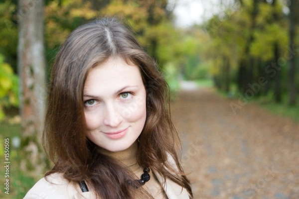 Fototapeta young woman in the autumn park