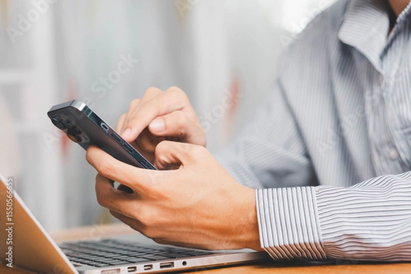 Fototapeta Laptop, hands and businessman with cellphone in office for online email communication for corporate review. Technology coffee and hr with computer and phone for reading company policy on internet,