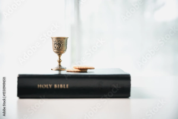 Obraz Christianity, holy communion ceremony is sacred act of worship and faith, where bread and wine in chalice symbolize body and blood of Christ in the religious eucharist tradition.