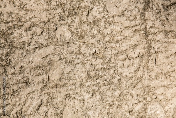 Fototapeta Textured rocky soil surface is being shown in flat design arid ground, highlighting fine cracks