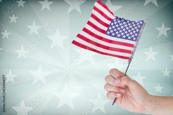 Obraz Cropped image of hand holding American flag