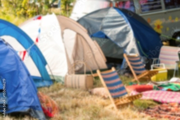 Obraz Tents by van and chairs on grassy field