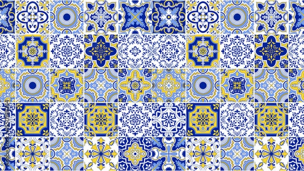 Obraz A pattern of blue and yellow square tiles with various floral and geometric designs arranged together