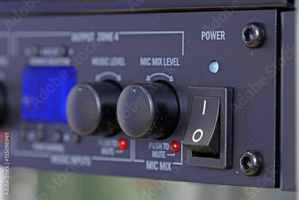 Fototapeta Front control panel of the audio amplifier with level controls and display. 