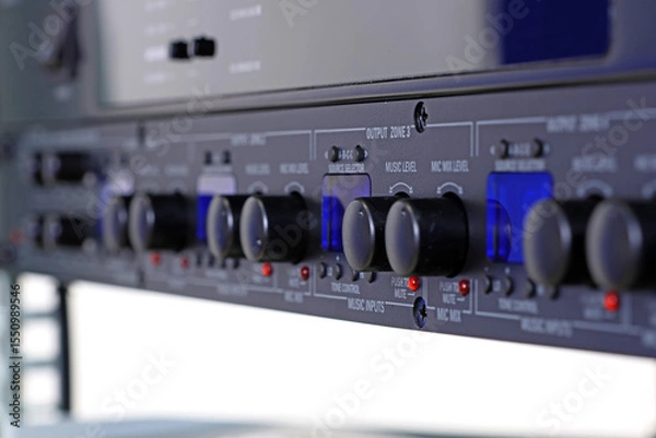 Fototapeta Front control panel of the audio amplifier with level controls and display. 