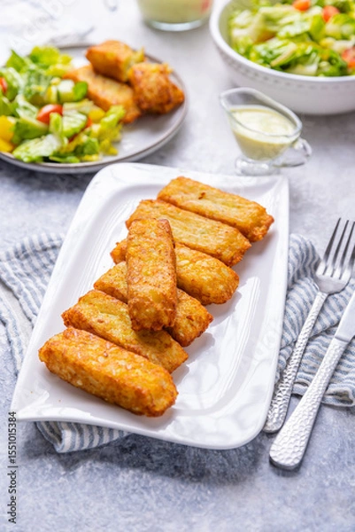 Obraz Fried potato pocked filled with cream cheese and herbs with mixed salad