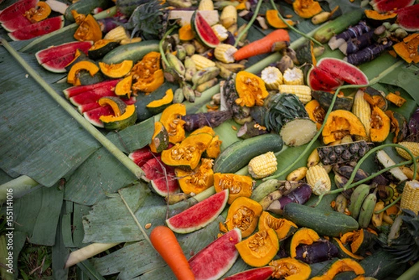 Fototapeta Watermelon slices and various fruits on banana leaves covered with banana leaves with various fruits. Elephant food at Thai Elephant Day, Elephant feeding fruit that it eats a lot of