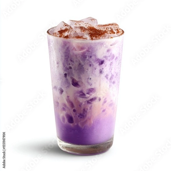 Fototapeta Purple beverage with creamy texture and ice cubes, topped with a sprinkle of cinnamon in a clear glass, perfect for summer refreshment and unique treats
