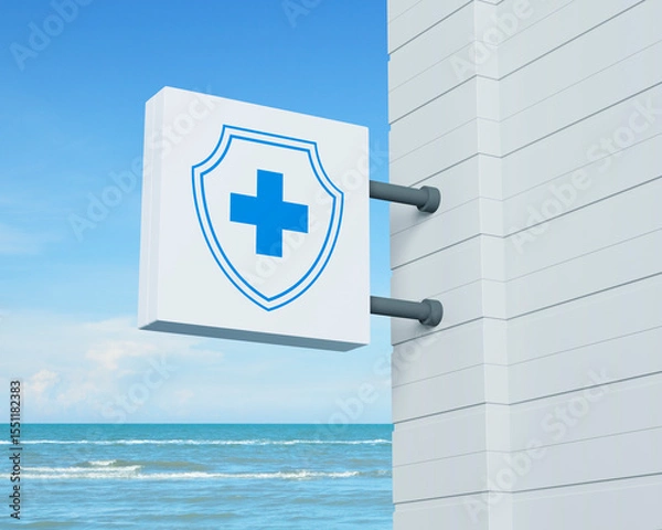 Fototapeta Cross shape with shield icon on hanging white square signboard over tropical sea and blue sky with white clouds, Business healthy and medical care insurance online concept, 3D rendering
