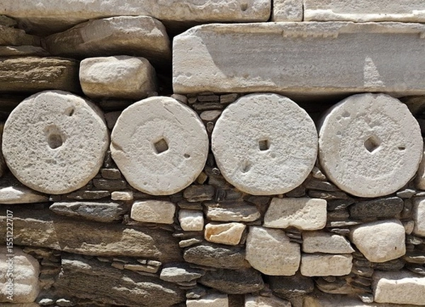 Fototapeta Photo of the ancient marble column drums reused in the Frankish castle, in Parikia on Paros island, a remarkable example of Cycladic architectural recycling from the classical period of Greece.