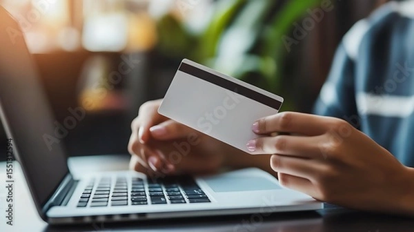 Obraz Hands holding blank credit card and using laptop online shopping concept e commerce finance and technology lifestyle setting