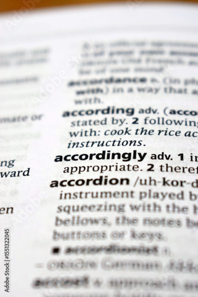 Obraz English Definition Dictionary Of Printed Word -  Accordingly Close Up
