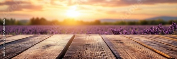 Obraz Wooden table with lavender field and sunlight in background, banner
