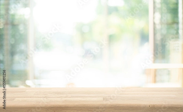 Fototapeta Selective focus.Empty of wood table top on soft blur of big glass window from living room background.not ai generated